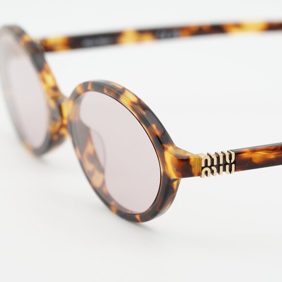 Miu Miu MU04ZS 14L4I0 Sunglasses Honey Havana Oval Frame, Pink Lenses